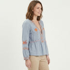 Blouse femme à manches bouffantes brodée de fleurs bleu avec décolleté en V