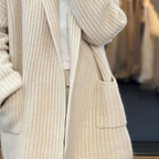 Cream knit cardigan deep patch pockets detail