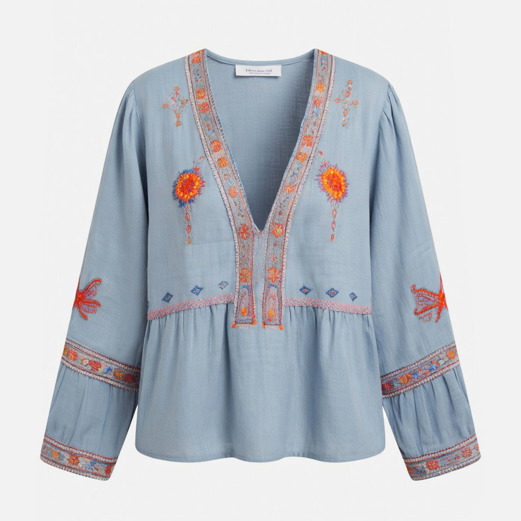 Blouse femme à manches bouffantes brodée de fleurs bleu avec décolleté en V