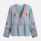 Blouse femme à manches bouffantes brodée de fleurs bleu avec décolleté en V