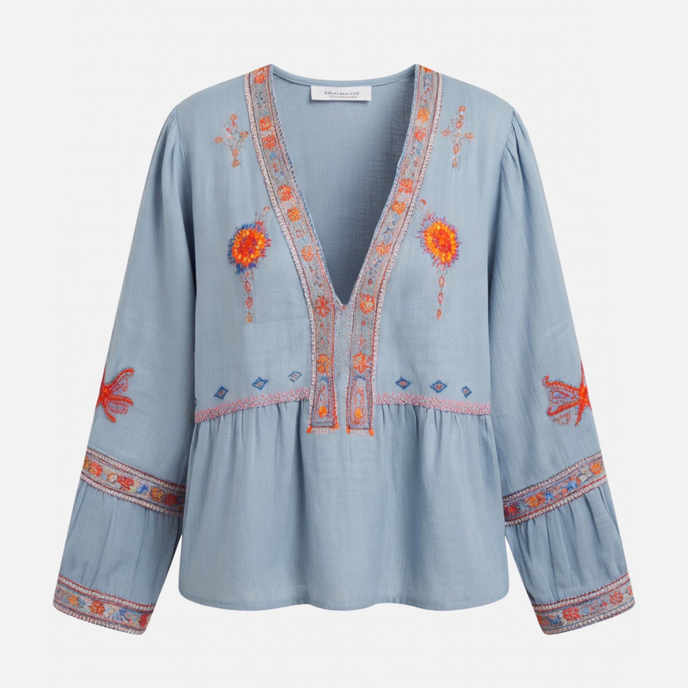 Blouse femme à manches bouffantes brodée de fleurs bleu avec décolleté en V