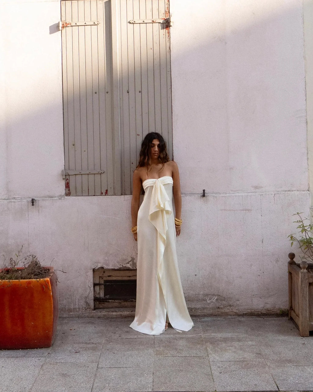 Cream strapless satin maxi dress detail