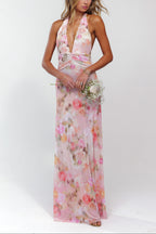Pink floral maxi dress with deep V-neck halter neckline, front view