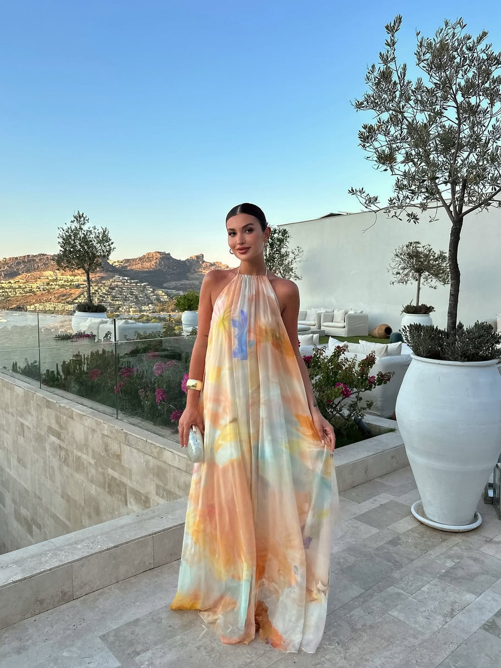 Halter neck printed maxi dress in orange, backless design, summer wedding guest style