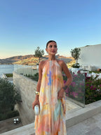 Orange halter maxi dress backless design, flowing silhouette, summer occasion wear