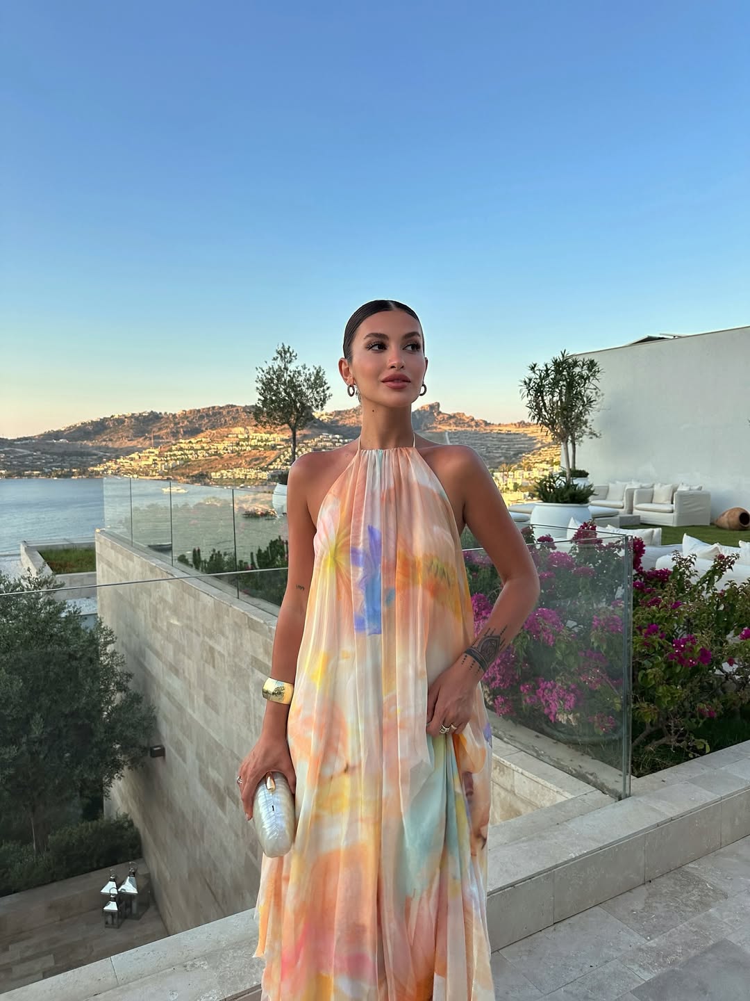 Orange halter maxi dress backless design, flowing silhouette, summer occasion wear
