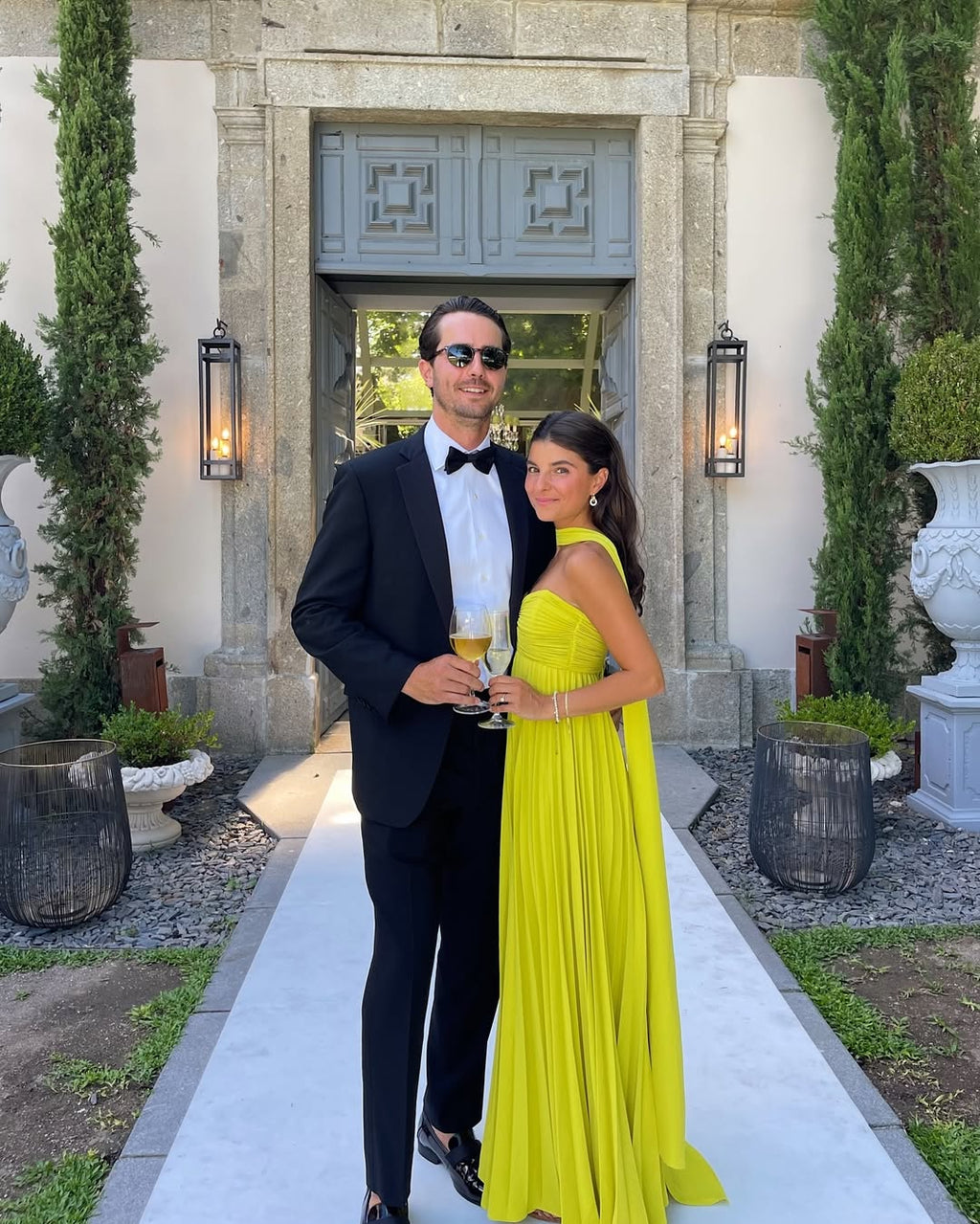 Strapless ruched bodice maxi dress yellow, fitted top, flowing pleated skirt side view