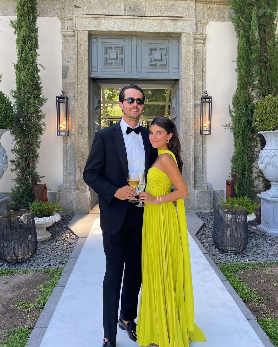 Strapless ruched bodice maxi dress yellow, fitted top, flowing pleated skirt side view