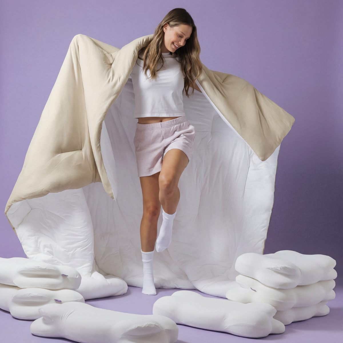 The Meringue Comforter in Sand, held open