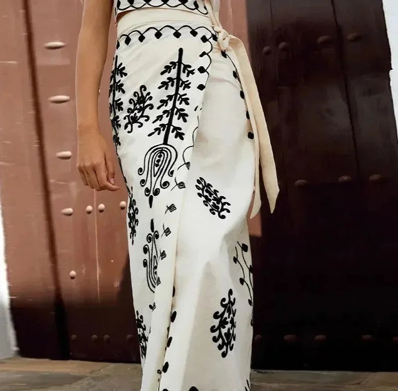 Embroidered sleeveless top and skirt set, delicate detail, lightweight summer fabric