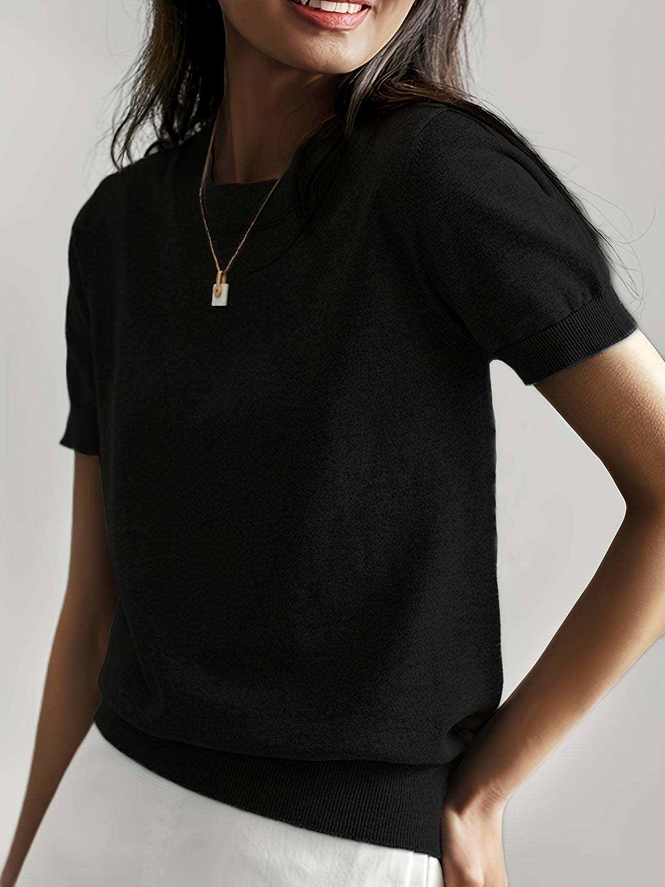 Black short sleeve knit sweater