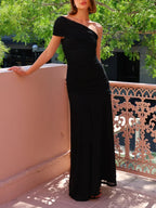 Black one-shoulder ruched maxi dress, asymmetric hem, elegant evening silhouette