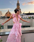 Floral sleeveless maxi dress flowing silhouette, colorful print, summer wedding look