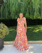 Floral sleeveless maxi dress with flowing cut, colorful print, summer wedding guest style